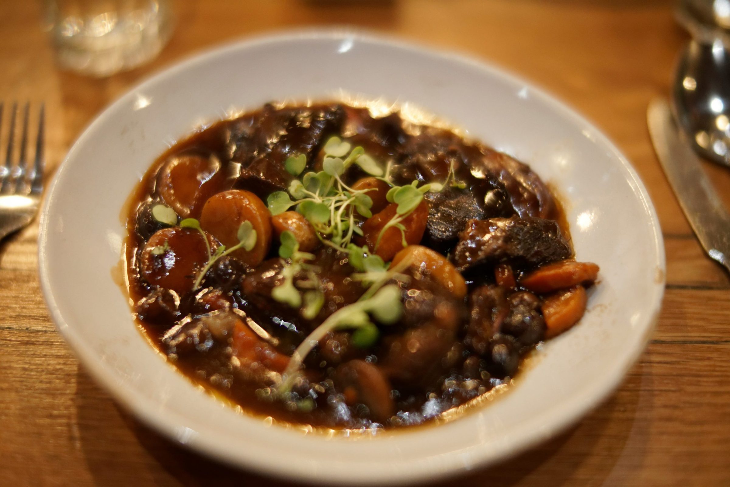 Coq au Vin with red wine, lardons, mushrooms and pearl onions