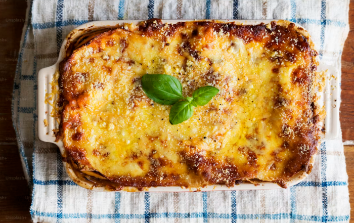 A proper Shepherd's Pie made with slow-braised lamb shoulder, rosemary-rich gravy, butter-and-cream mash and a golden Parmesan crust.